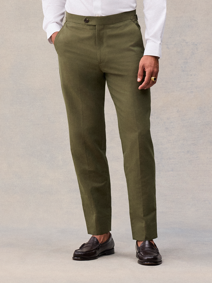 Vintage olive suit pant on model, cropped waist to hem, tab waistband and tapered leg