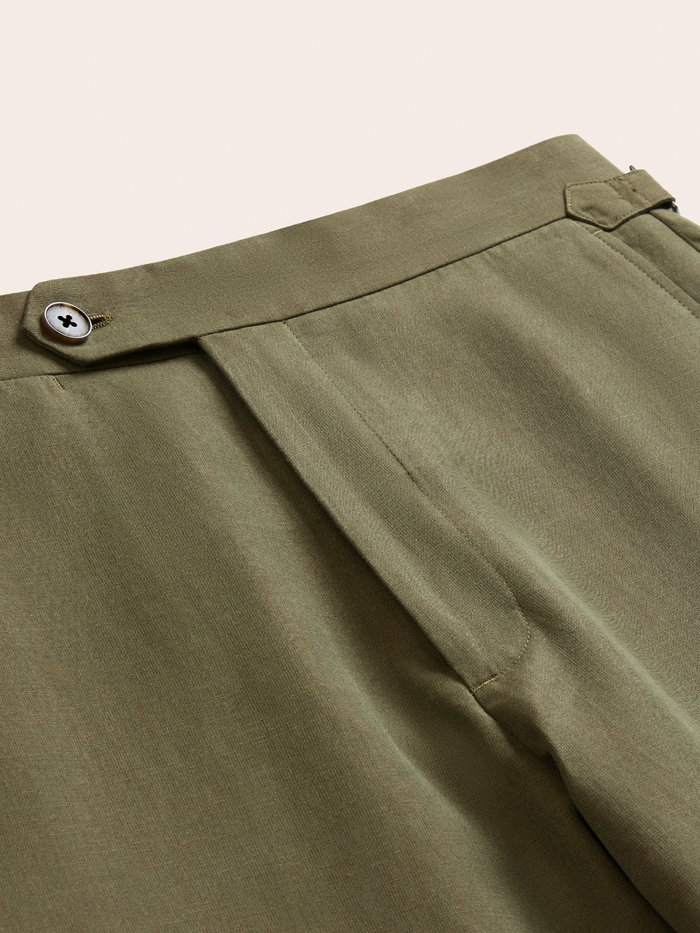 Vintage olive suit pant waistband detail, closed with side tab and button