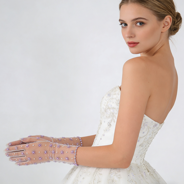 Bride wearing lavender crystal embellished tulle gloves with a wedding gown during an elegant bridal photoshoot.