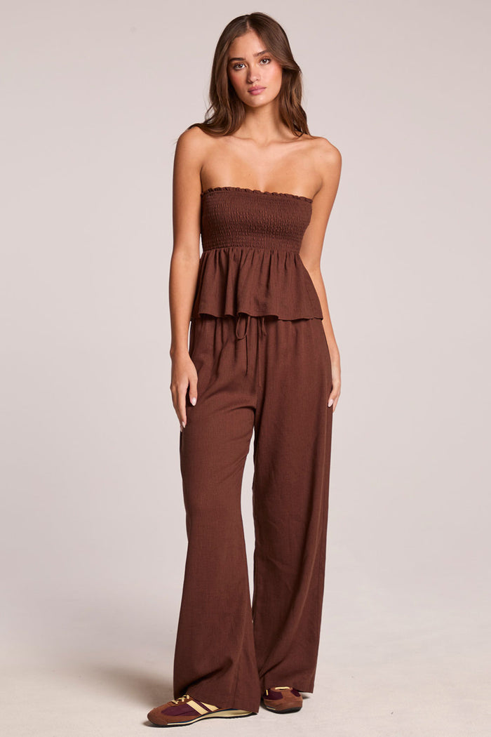 A full body front view of a woman wearing the Chaser  Lee Kahlua Trouser on a neutral background