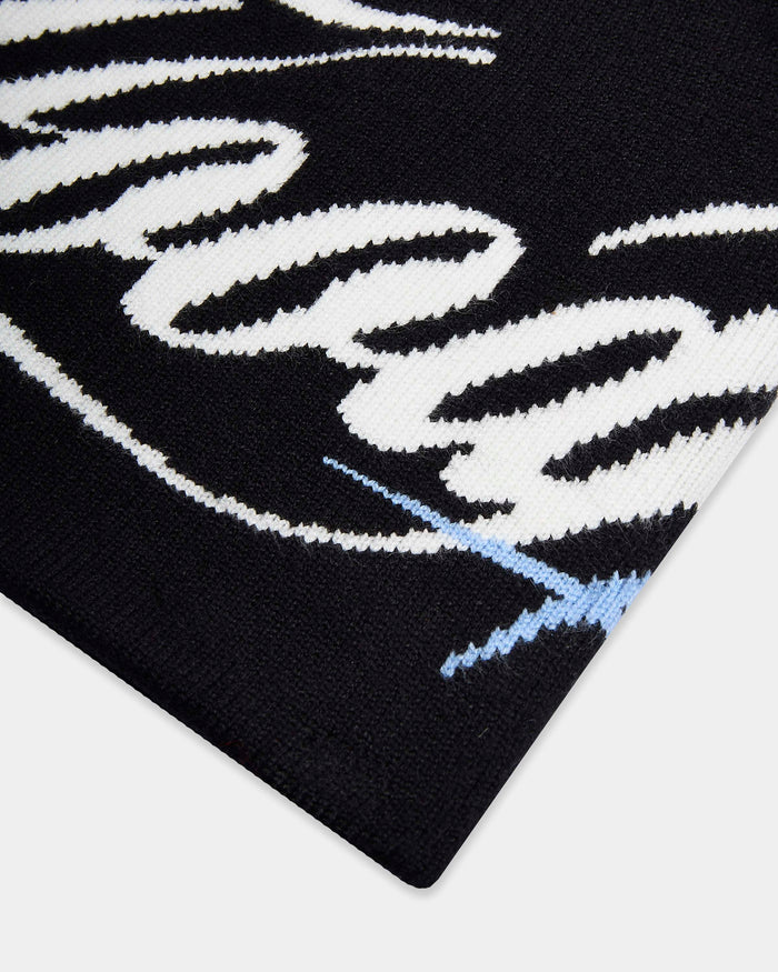 Black and white patterned fabric with a blue line on a white background