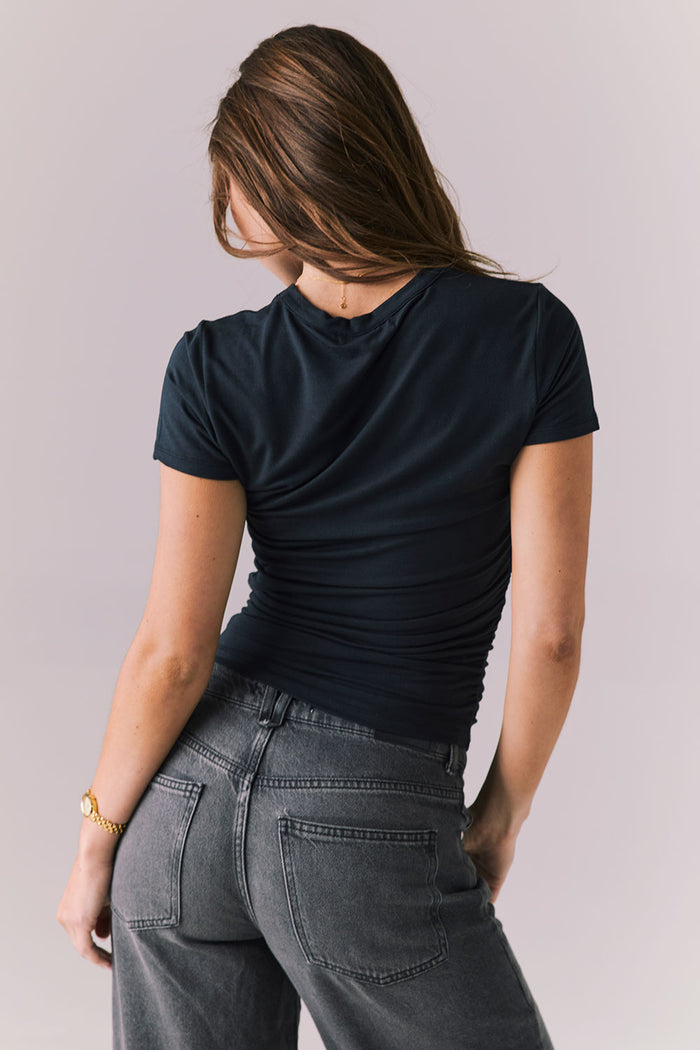 Back view of Chaser Brand Louiss Licorice Black Tee highlighting smooth stretch fit and minimal seam design