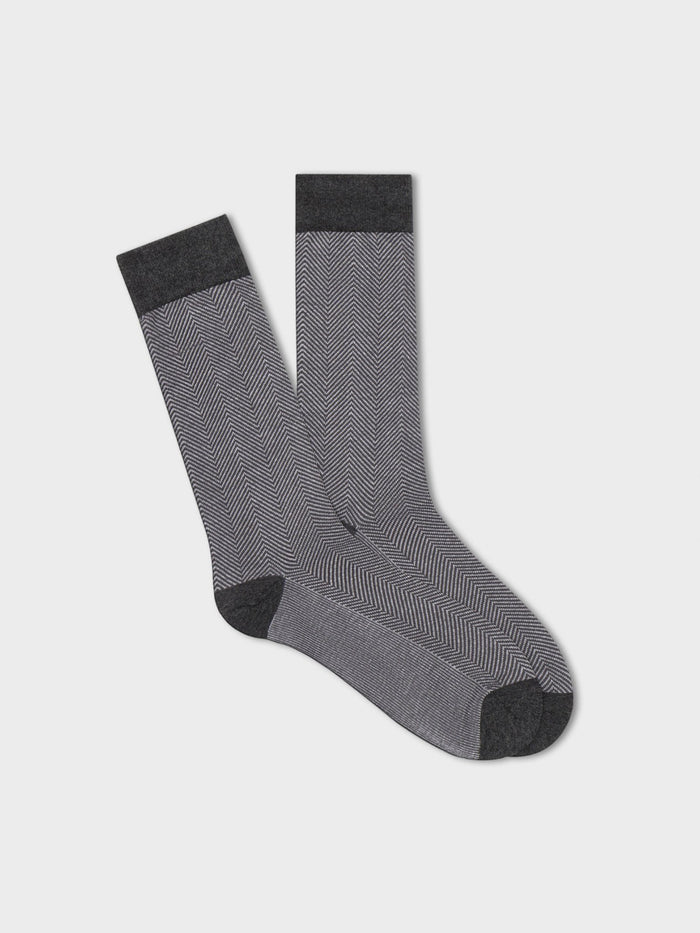 Light grey herringbone dress socks, flat lay with dark grey heel and toe