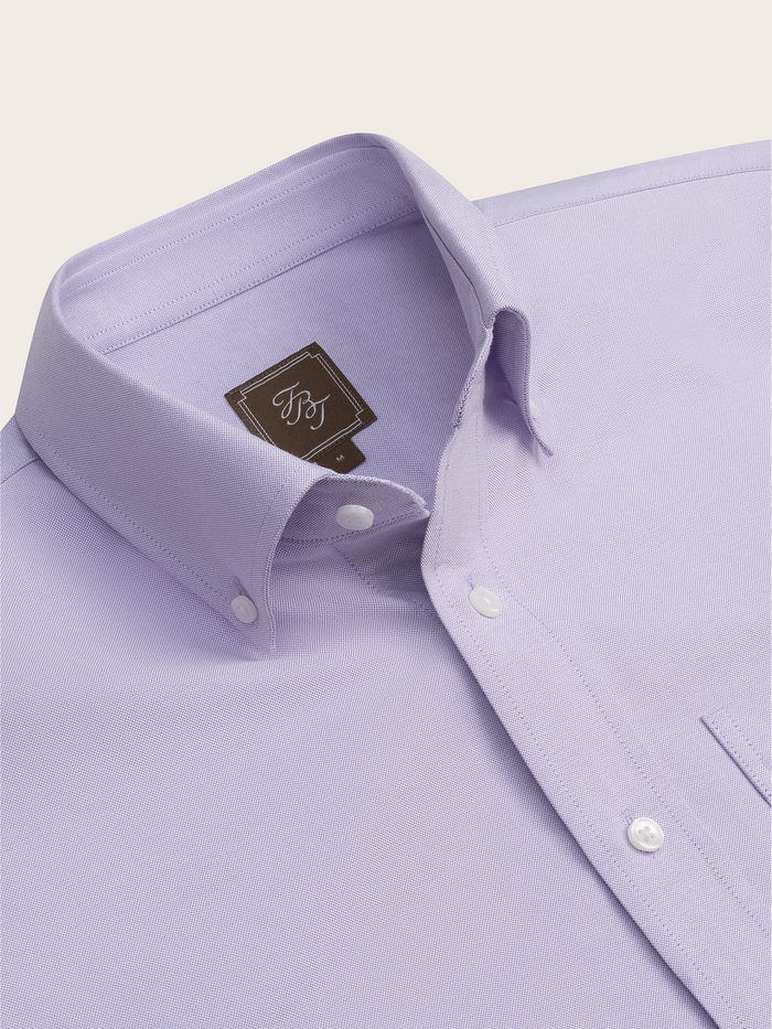 Close-up of lilac oxford shirt collar and brand label