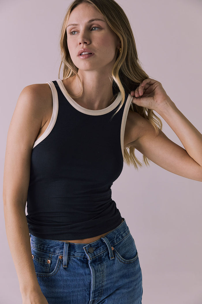 Close-up of Chaser Brand Lisbon Licorice Tank showing smooth stretch texture and contrast binding detail