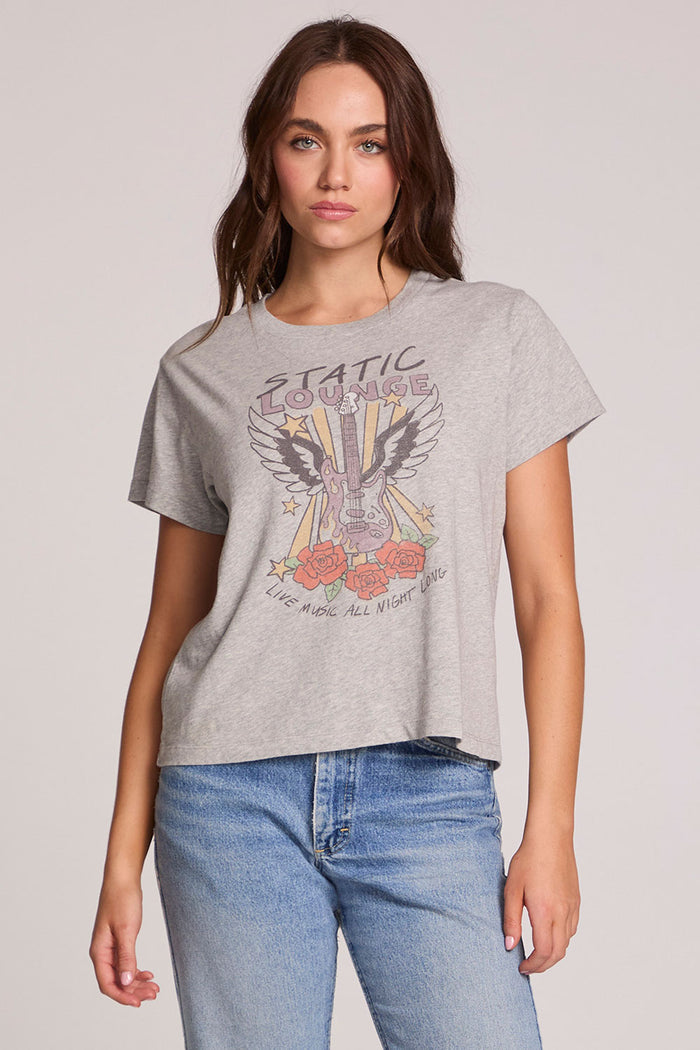 Front view of a woman wearing the Chaser  Live Music Graphic Tee on a neutral background
