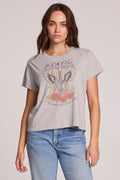 Front view of a woman wearing the Chaser  Live Music Graphic Tee on a neutral background