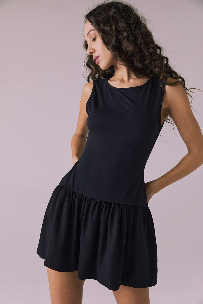 Close-up of Chaser Brand Lou Licorice Black Mini Dress showing gathered waist seam and soft fabric texture
