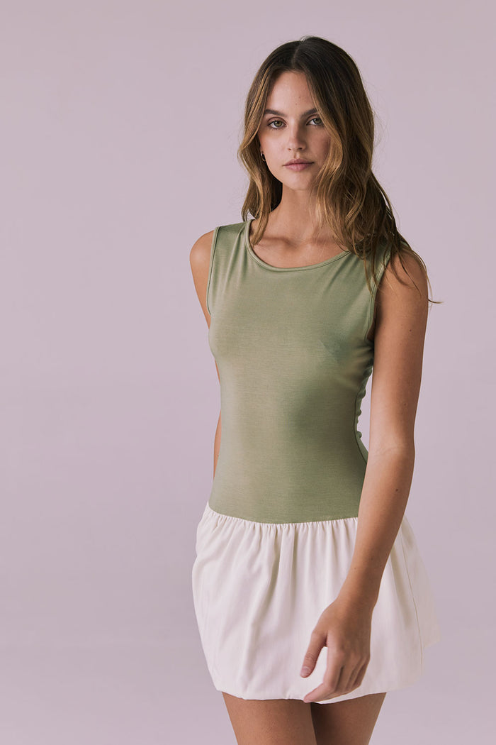 Three quarter angle of Chaser Brand Lou Meadow Green Mini Dress showing flattering silhouette and lightweight movement