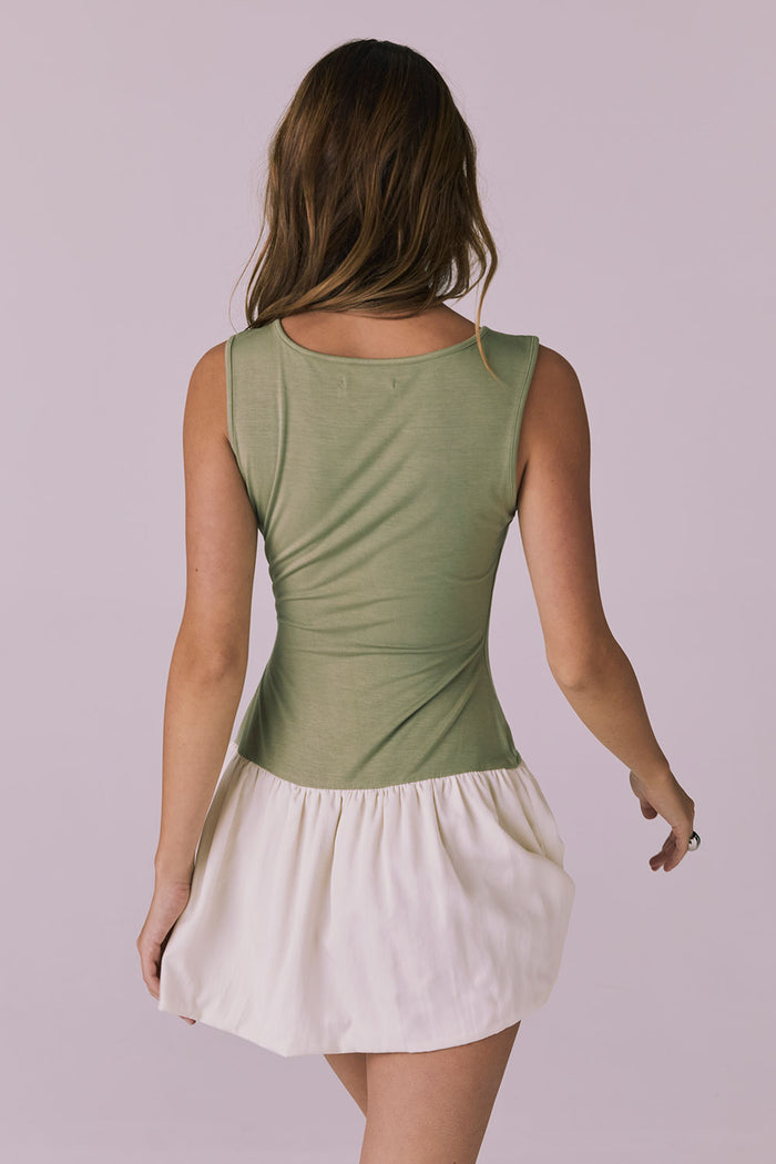 Back view of Chaser Brand Lou Meadow Green Mini Dress featuring a clean scoop neckline and softly flared skirt