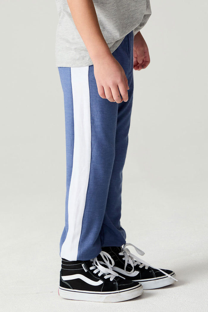 Side view of a boy wearing the Chaser Lounge Pants Boys Shamu Jogger on a neutral background with shirt