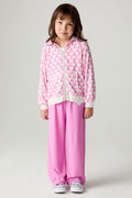 Front view of a girl wearing the Chaser Love Is Everywhere Girls Pants Jogger with sneakers