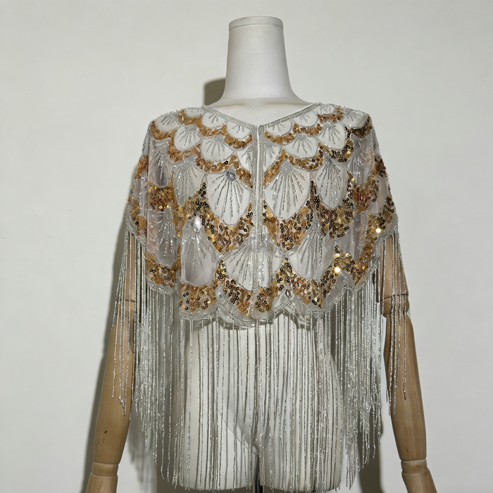 Luxury handcrafted bridal capelet with shimmering sequins, bead embroidery and flowing fringe in elegant ivory.