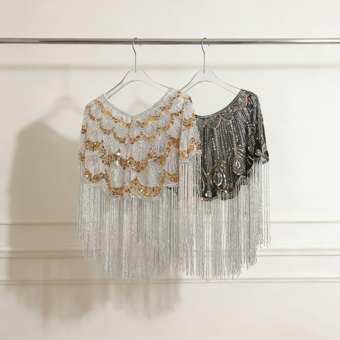 Luxury handcrafted bridal capelet with shimmering sequins, bead embroidery and flowing fringe in elegant ivory.
