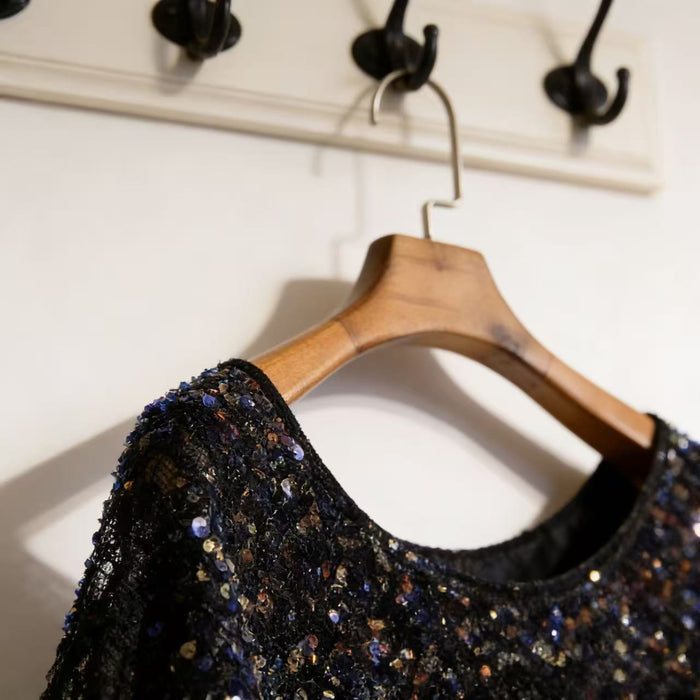 Luxury black lace capelet with shimmering sequins for bridal and evening wear.