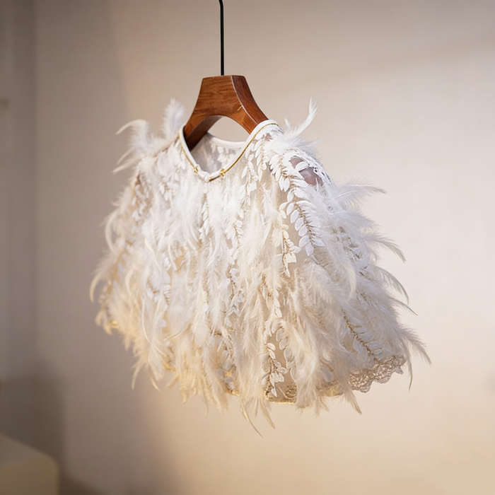 Luxury feather bridal capelet featuring embroidered leaf tulle and soft white feathers for an elegant wedding look.
