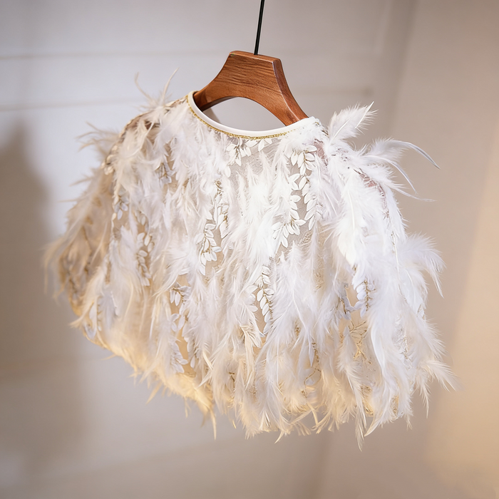 Luxury feather bridal capelet featuring embroidered leaf tulle and soft white feathers for an elegant wedding look.