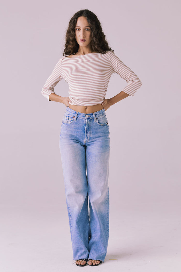 Full body front view of Chaser Brand Malynne Khaki Stripe Tee styled with light-wash denim and sandals