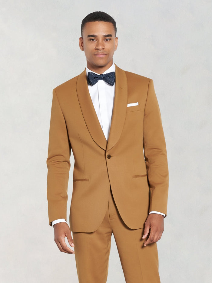 Man in marigold shawl-lapel tuxedo suit and navy bow tie, front view