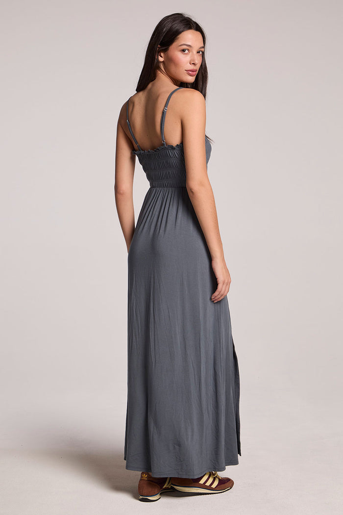 Back view of a woman wearing the Chaser Future Grey Marquise Dress on a neutral background