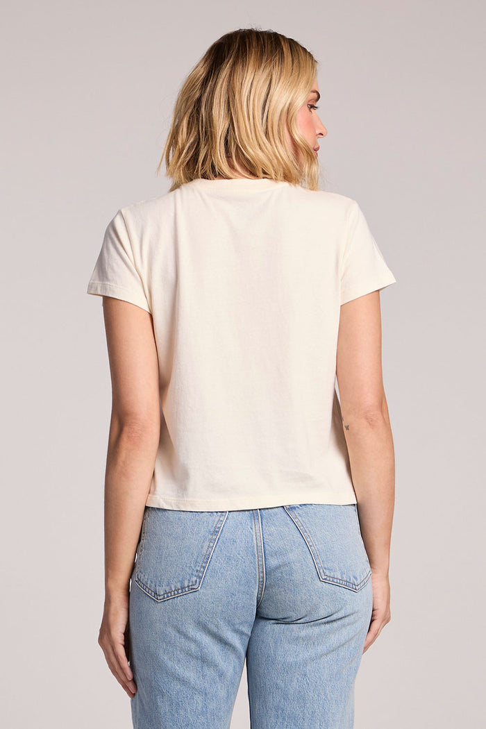 Back view of a woman wearing the Chaser Mas Margaritas Tee on a neutral background