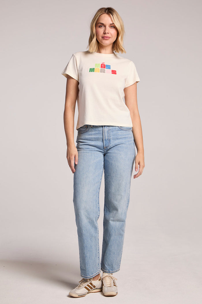 Full body front view of a woman wearing the Chaser Mas Margaritas Tee and sneakers on a neutral background