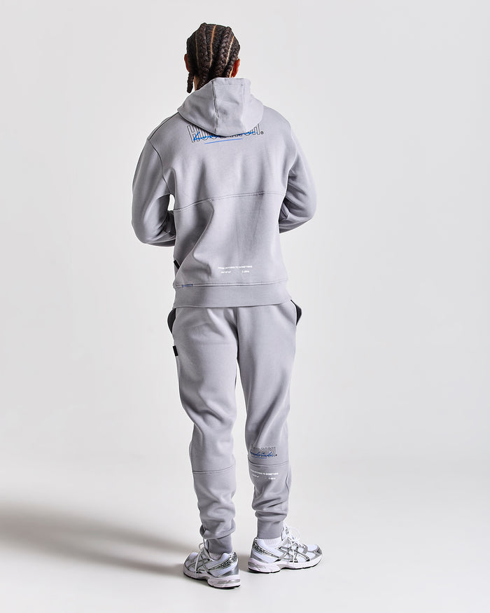 Displays a model wearing the Grey 'Hoodrich' branded men's blend Full Tracksuit