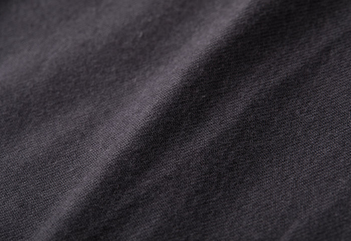 Close-up of the Men's Cascade Flannel Shirt in Charcoal Grey, showing its Portuguese cotton flannel fabric with visible weave and soft diagonal folds—ideal for a modern look.