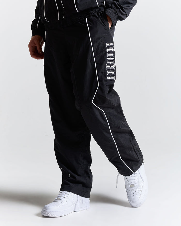 Black tracksuit with 'Hoodrich' branding on a white background