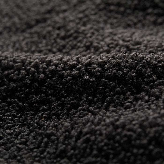 Close-up of the Men's Cypress Sherpa Fleece in Onyx Black, highlighting its soft, curly surface and thick, cozy heavyweight fabric.