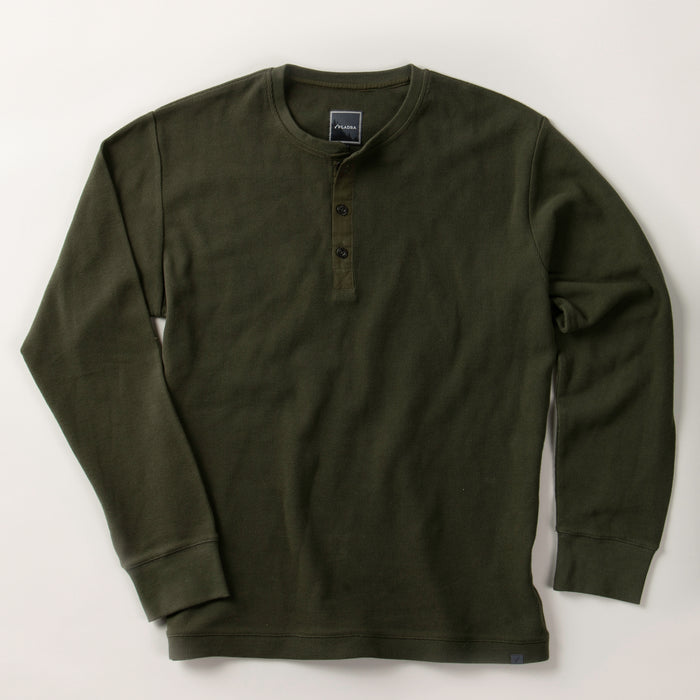 Men's Elko Henley by Pladra in forest green, cotton waffle knit, 3 buttons, long sleeves, laid flat on light surface.