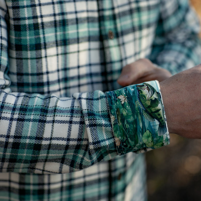 A person in a Pladra Men's Every Day Elite Flannel Shirt–Everglade White shows its floral inner cuff.
