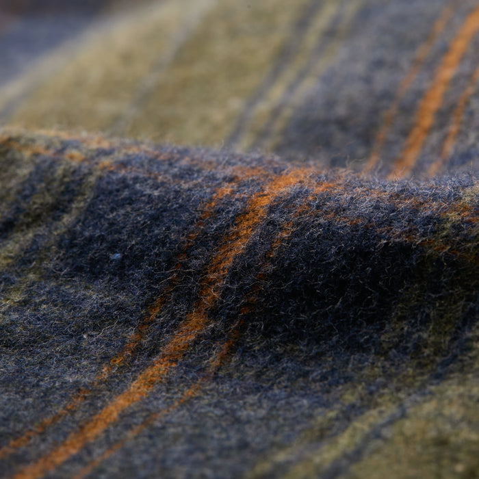 Close-up of the soft, textured fabric on the Men's Every Day Flannel Shirt- Everett Green Heather, featuring a plaid pattern with blue, green, and orange stripes—ideal for a comfortable outdoor shirt.