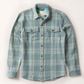 Pladra Men's Fireside Flannel in Island Blue with button front, two chest pockets, and long sleeves on white background.