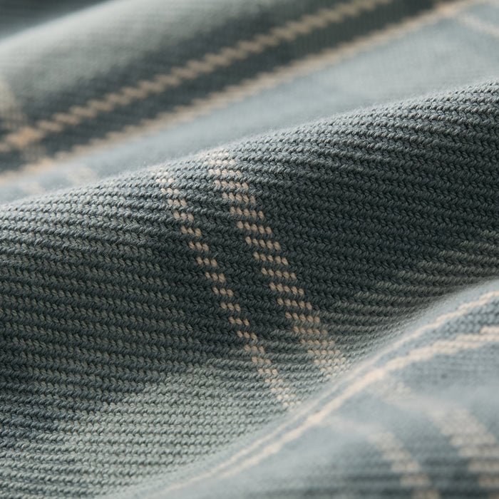 Close-up of Pladra Men's Fireside Flannel - Island Blue, showing its soft texture and blue-beige plaid pattern.