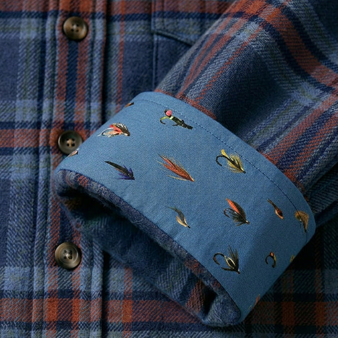 Pladra Men's Fireside Flannel in Missoula Blue with blue cuff and multicolor embroidered fishing flies.