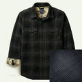 Men's Fireside Flannel in Night Black, a heavyweight organic cotton black plaid with two chest pockets and contrasting inner lining.