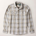 Men's Fireside Flannel in Quartz Grey, an organic cotton plaid in grey, beige, and white with two chest pockets and brown buttons.