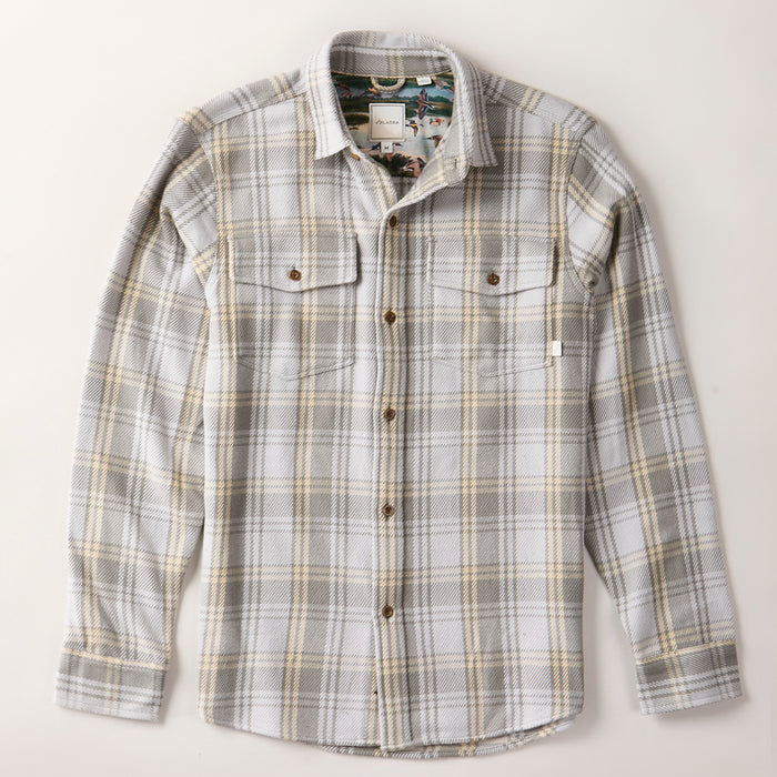 Men's Fireside Flannel in Quartz Grey, an organic cotton plaid in grey, beige, and white with two chest pockets and brown buttons.