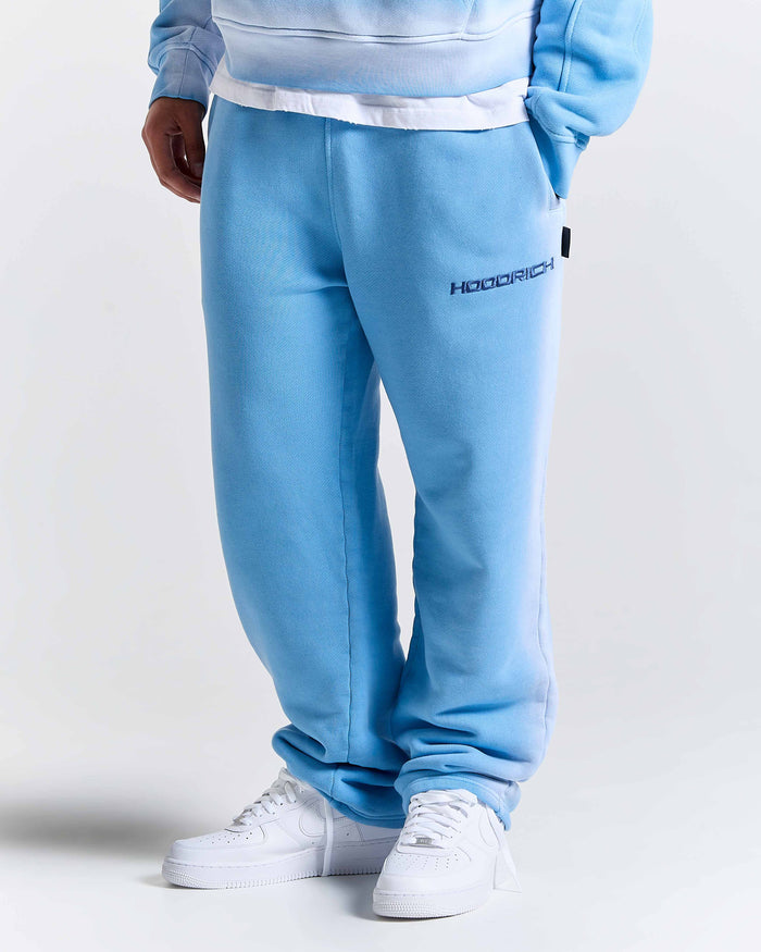 Light blue tracksuit with 'Hoodrich' branding on a white background