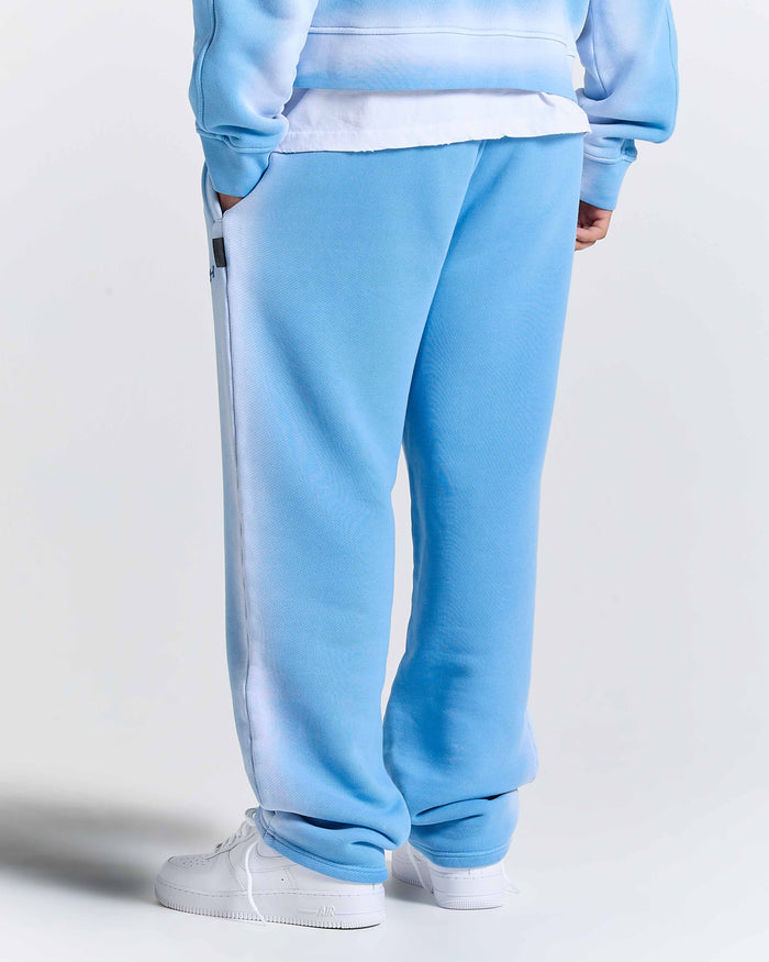 Light blue tracksuit with white stripes on a plain background