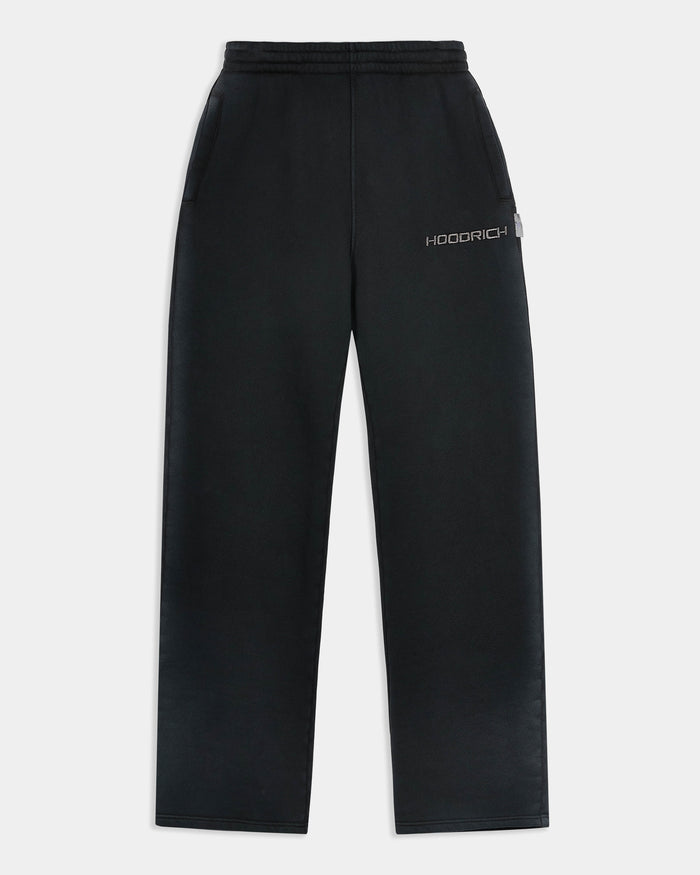 Black pants with 'Hoodrich' branding on a light gray background