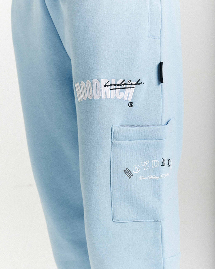 Light blue pants with 'Hoodrich' branding on a white background