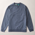 The Pladra Men's Klamath Crew in Stone Blue is a classic-fit, long-sleeve sweatshirt laid flat on a light surface.