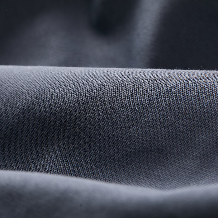 Close-up of Pladra Men's Klamath Crew in Stone Blue, showing its soft, smooth, premium cotton fabric with subtle texture.