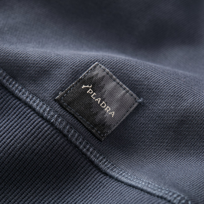 A close-up of the Men’s Klamath Crew in Stone Blue by Pladra, featuring a black Pladra label.