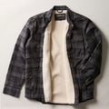 Pladra Men's Northwood Sherpa Insulated Flannel Jacket in Deadwood Black shown open on a white surface.