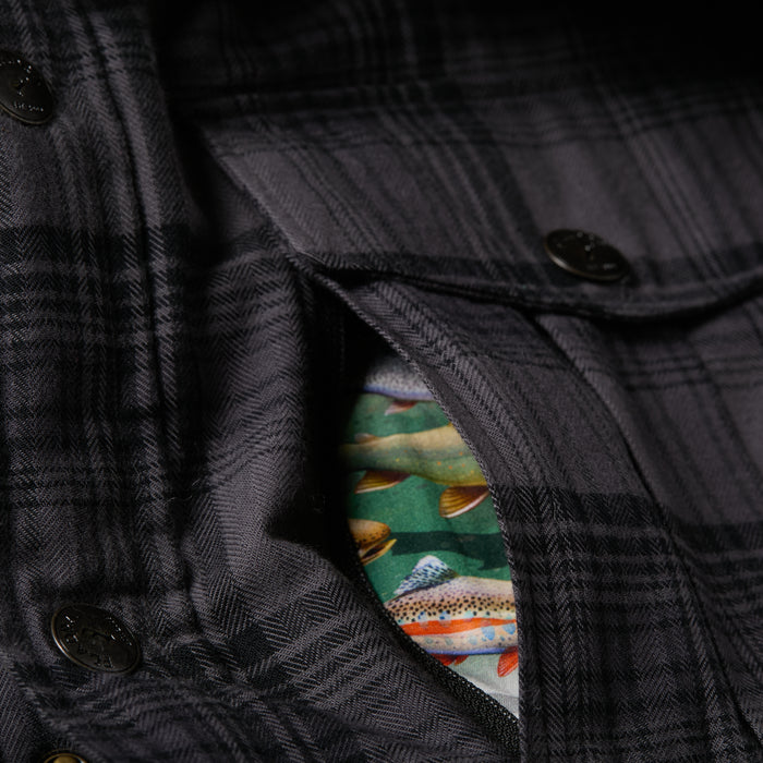 A close-up shows the Pladra Men's Northwood Sherpa Jacket in Deadwood Black, featuring a colorful fish-patterned pocket lining.