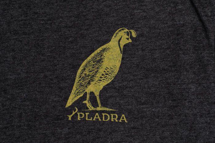 Yellow quail art above Pladra logo on Men's Quail Tee—Charcoal Grey Heather cotton jersey.