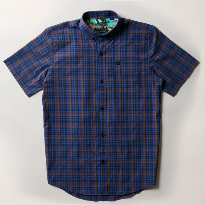 Men's Short Sleeve Tailwinds Shirt by Pladra in Lagoon Blue plaid, with chest pocket, shown laid flat on white.